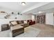 Comfortable living room with plush seating, carpet flooring, and built-in shelving at 19131 E Garden Pl, Centennial, CO 80015