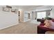 Open-concept living area with TV and comfortable furniture in a neutral color palette at 19131 E Garden Pl, Centennial, CO 80015
