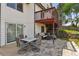 Inviting outdoor patio with stone pavers, comfortable seating, and a charming upper deck at 19131 E Garden Pl, Centennial, CO 80015