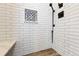 Sleek bathroom shower with subway tile and bench at 19131 E Garden Pl, Centennial, CO 80015