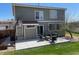 Spacious backyard features a concrete patio, perfect for outdoor entertaining and relaxing at 4614 Lyndenwood Cir, Highlands Ranch, CO 80130