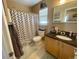 Full bathroom with a shower and tub combination and a stylish vanity at 4614 Lyndenwood Cir, Highlands Ranch, CO 80130