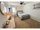 Bright bedroom includes a ceiling fan, a comfy bed, and a large window offering plenty of natural light at 4614 Lyndenwood Cir, Highlands Ranch, CO 80130