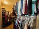 Walk-in closet providing lots of storage space for clothing and accessories at 4614 Lyndenwood Cir, Highlands Ranch, CO 80130