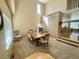 Bright dining room with tall ceilings and a dining table with six chairs at 4614 Lyndenwood Cir, Highlands Ranch, CO 80130