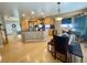 Bright, open kitchen featuring granite counters, modern appliances, and breakfast area at 4614 Lyndenwood Cir, Highlands Ranch, CO 80130