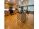 Inviting kitchen with stainless steel appliances, center island, and breakfast nook at 4614 Lyndenwood Cir, Highlands Ranch, CO 80130
