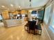 The bright, open kitchen features granite counters, modern appliances, and a breakfast area at 4614 Lyndenwood Cir, Highlands Ranch, CO 80130