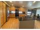 Beautiful kitchen boasting an island, stainless appliances, and ample cabinet space at 4614 Lyndenwood Cir, Highlands Ranch, CO 80130