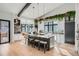 Bright and spacious kitchen featuring a large island with barstool seating and views of outdoor scenery at 21429 Trappers Trl, Morrison, CO 80465