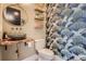 Stylish powder room with unique sink and wall decor, adding a touch of elegance to the home at 21429 Trappers Trl, Morrison, CO 80465