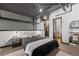 Bedroom with closet entrance, overhead ductwork and dark accents at 1555 California St # 419, Denver, CO 80202