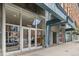 Exterior view of building entrance with glass doors and storefront windows at 1555 at 1555 California St # 419, Denver, CO 80202