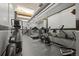 Spacious gym area featuring modern equipment including treadmills, stationary bikes, and weight machines at 1555 California St # 419, Denver, CO 80202