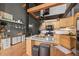 Kitchen island in bright kitchen with wood cabinets, and black appliances, exuding a welcoming and modern charm at 1555 California St # 419, Denver, CO 80202