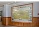 A vintage, framed map of Denver from 1908 hangs above wood paneling in this building's lobby at 1555 California St # 419, Denver, CO 80202