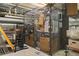 Locked storage unit in basement filled with packed boxes, bins, and other household items at 1555 California St # 419, Denver, CO 80202