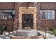 Charming brick building with a decorative entrance and wrought iron railing welcomes you home at 1060 N Washington St # 103, Denver, CO 80203