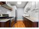 Updated kitchen with stainless steel appliances, granite countertops, and modern white subway tile backsplash at 1060 N Washington St # 103, Denver, CO 80203