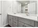 Bathroom vanity with double sink and gray cabinets at 1368 Orchard St, Brighton, CO 80601
