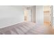 Bedroom with neutral walls and carpet, and a doorway to the closet at 1368 Orchard St, Brighton, CO 80601