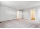 Large bedroom features neutral carpet and multiple entry doors at 1368 Orchard St, Brighton, CO 80601