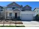 Charming two-story home featuring a two-car garage, landscaped front yard, and inviting covered porch at 1368 Orchard St, Brighton, CO 80601
