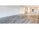 Bright, open-concept living space with hardwood floors and modern kitchen access at 1368 Orchard St, Brighton, CO 80601