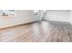 Spacious living room with hardwood floors and ample natural light through large windows at 1368 Orchard St, Brighton, CO 80601