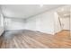 Open-concept living room with beautiful hardwood floors and modern lighting at 1368 Orchard St, Brighton, CO 80601