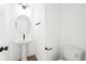 Small bathroom with toilet, sink, mirror and hardwood floors at 2672 W 68Th Ave, Denver, CO 80221