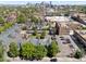 Aerial view showcases well-maintained townhome community and proximity to downtown skyline at 11 W Ellsworth Ave # 22, Denver, CO 80223