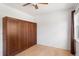 Hardwood floors and a murphy bed accent this light-filled bedroom at 11 W Ellsworth Ave # 22, Denver, CO 80223