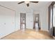 This bedroom offers hardwood floors, a ceiling fan, and a double-door closet at 11 W Ellsworth Ave # 22, Denver, CO 80223