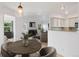 Open concept dining area leads to living room and kitchen with great natural lighting at 11 W Ellsworth Ave # 22, Denver, CO 80223