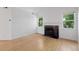 Bright and spacious living room with hardwood floors, fireplace, and ample natural light at 11 W Ellsworth Ave # 22, Denver, CO 80223