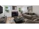 Cozy living room features a fireplace, hardwood floors and large windows providing natural light at 11 W Ellsworth Ave # 22, Denver, CO 80223