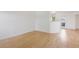 Bright open floorplan with freshly painted walls and hardwood flooring throughout the living spaces at 11 W Ellsworth Ave # 22, Denver, CO 80223