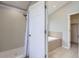 Shower room with tile surround and a tub with tile surround adjacent to the shower at 6493 W 98Th Ct, Westminster, CO 80021