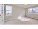 Bedroom with two large windows, a neutral color scheme, and lots of natural light at 6493 W 98Th Ct, Westminster, CO 80021