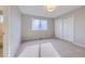 Bedroom with large window and closet with sliding doors at 6493 W 98Th Ct, Westminster, CO 80021