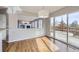 Bright dining room with sliding glass door to backyard, connected to living room and fireplace at 6493 W 98Th Ct, Westminster, CO 80021