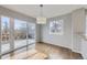 Bright dining area with sliding glass door to the backyard patio at 6493 W 98Th Ct, Westminster, CO 80021