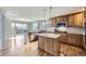 Modern kitchen featuring granite countertops, stainless steel appliances and a center island at 6493 W 98Th Ct, Westminster, CO 80021