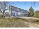 Two-story home featuring sliding glass doors, large windows, and a well-maintained backyard at 6493 W 98Th Ct, Westminster, CO 80021