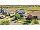 Two-story home with manicured landscaping and a cozy front porch, in an idyllic community at 12400 Village Cir, Brighton, CO 80603