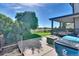 Backyard featuring a concrete patio with a fire pit at 12400 Village Cir, Brighton, CO 80603