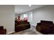 Cozy finished basement offers a seating area that opens up to additional rooms at 12400 Village Cir, Brighton, CO 80603