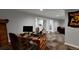 Basement area with home office setup, desk, and decorative sports themed wall art at 12400 Village Cir, Brighton, CO 80603