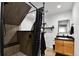 Bathroom featuring a shower with built in bench, a vanity, and black fixtures at 12400 Village Cir, Brighton, CO 80603
